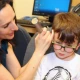 Audiologist testing a child