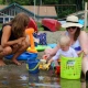 Two adults and a child on the beach