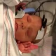 A baby undergoing a hearing test
