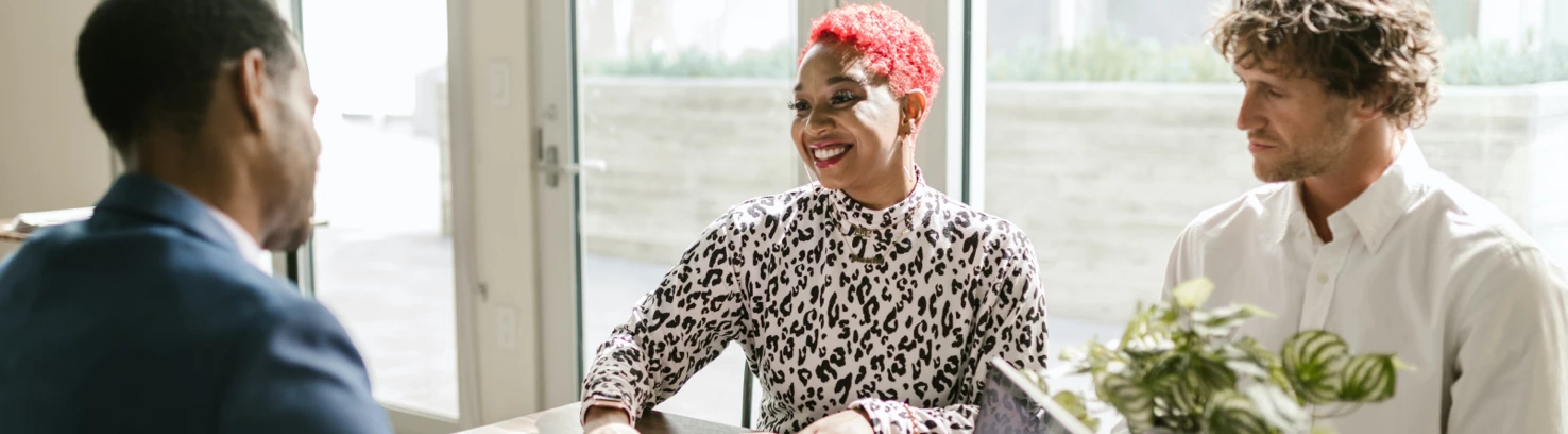 Three people having a meeting